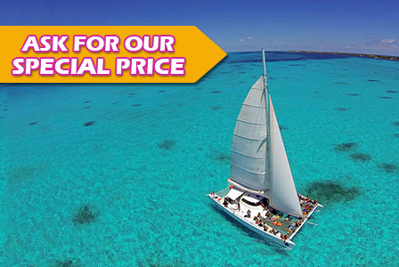 Sail to Isla Mujeres on a private catamaran.